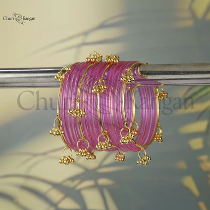 Pink glossy jelly kangan bangles with gold embellishments